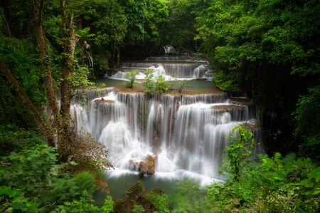 Huay mae khamin waterfall, this cascade is emerald green and popular in Kanchanaburi province, Thailand.の写真素材
