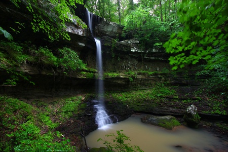 Waterfall flows into a deep canyon in the woodland of northern Alabamaの写真素材