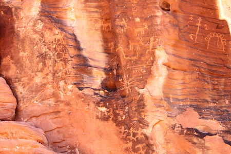 Strange petroglyphs on a rock wall at Valley of Fire State Park in Nevadaの写真素材
