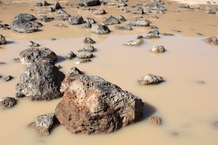 Small puddle at the bottom of Amboy Crater in the deserts of southern Californiaの写真素材