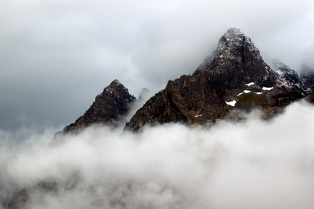 Dense clouds obscure jagged peaks of the Teton Range in western Wyoming