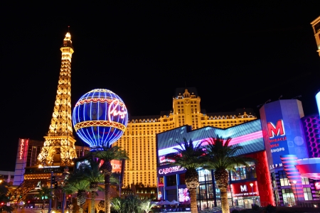 Las Vegas, USA - November 30, 2011: The Paris Las Vegas is a hotel and casino in Nevada.  Seen on the left are the venues replicas of the Eiffel Tower and the Montgolfier Balloon adorned in bright lights.のeditorial素材