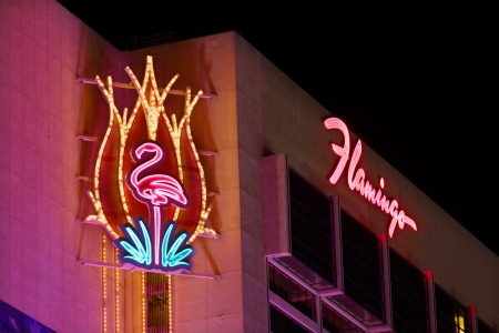 Las Vegas, USA - November 30, 2011: The Flamingo Las Vegas is a hotel and casino located on the famous Las Vegas Strip and has a art deco theme.  Seen here is the top portion of the hotel building with decorative neon signs.のeditorial素材
