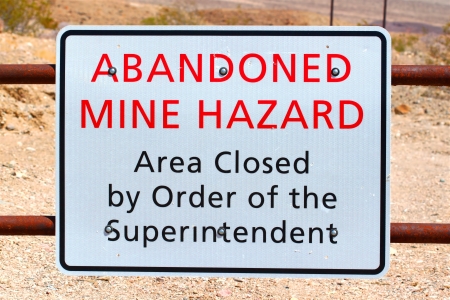 Sign warning of an Abandoned Mine Hazard in Death Valley National Parkの写真素材