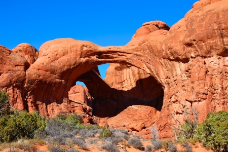 Double Arch spans the valley floor of Arches National Park in Utahの写真素材