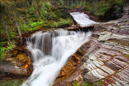 Waterfall in Glacier National Park of Montanaの写真素材