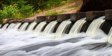 Cascades of water at the Bond Falls Scenic Site in Michiganの写真素材
