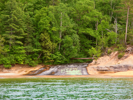 Chapel Creek flows into Lake Superior at Pictured Rock National Lakeshore in Michiganの写真素材