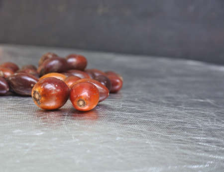 A closeup shot of jujubes bunch on a smooth metal surface