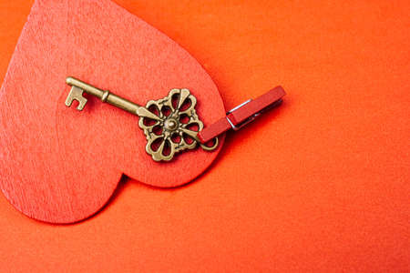 A closeup shot of a small handmade valentine days gift isolated on red background