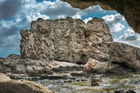 A beautiful scenery of rock formations under a cloudy skyの写真素材