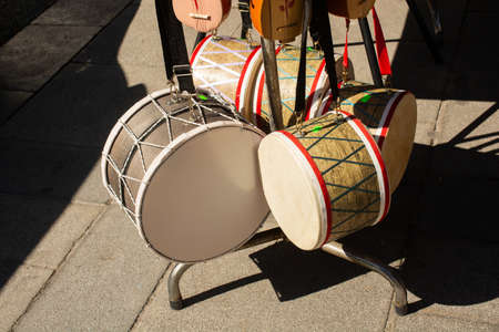 A high angle shot of different sized davuls in the market outdoors