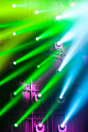 A vertical shot of colorful club lights setting a party moodの写真素材