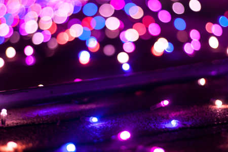 A beautiful shot capturing the purple and blue lights with pink hues that create a bokeh light effectの写真素材