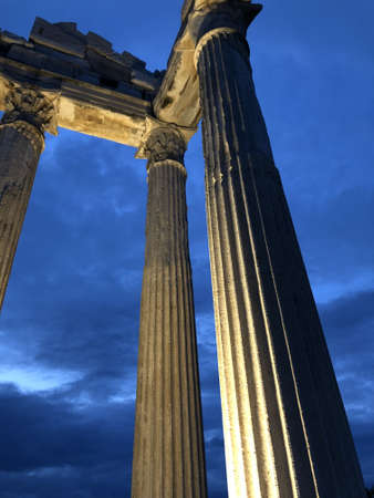 A low angle vertical shot of the amazing Apollon Temple in Turkeyの写真素材