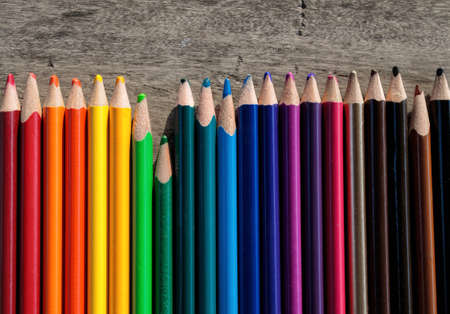 A closeup shot of colorful pencils in a shade sequence from the brightest to the darkest