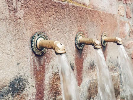 A closeup shot of water fountains in Viniegra of Arriba, La Rioja, Spainの写真素材