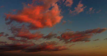 A beautiful orange sky with clouds during the sunset