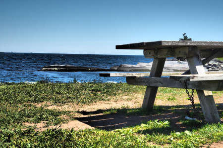 A bench in the beach in the park in Halifax, Nova Scotia, Canadaの写真素材