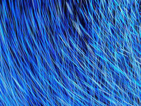 An abstract shot of blue light lines on a black background with cutting-edge shooting technologyの写真素材