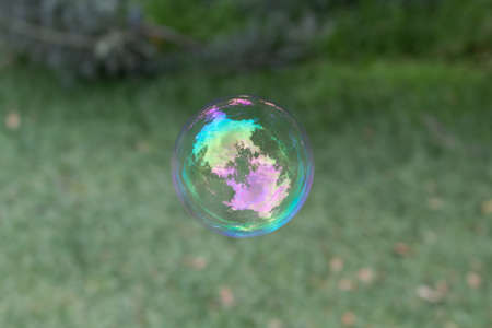 A closeup shot of a soap bubble in the air