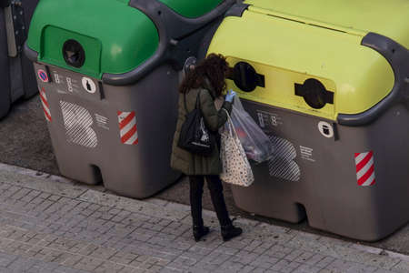 BARCELONA, SPAIN - Apr 02, 2020: People on street during COVID-19 confinement in Barcelona,Spain. Coronavirus Social Distancing.のeditorial素材