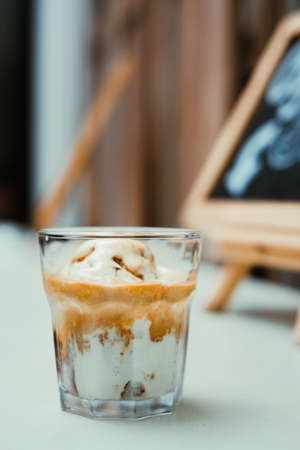 Sweet coffee with ice cream in a glass