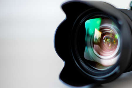A closeup shot of a camera lens on a white backgroundの写真素材