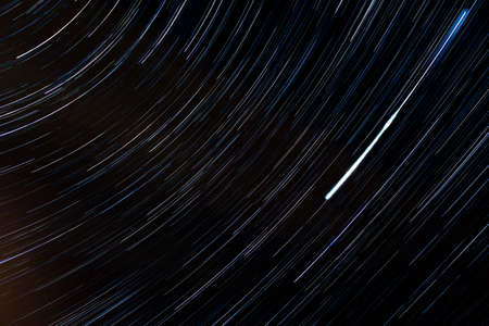 A closeup of a spinning vinyl on a record player shot with long exposure