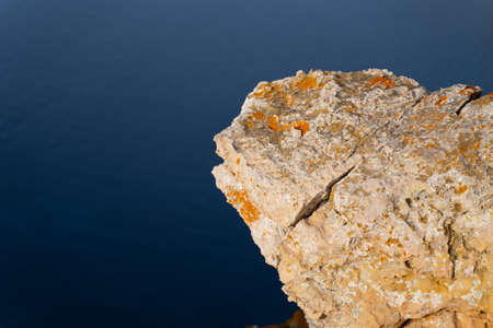 A beautiful shot of rocky cliffs of the sea on a sunny dayの写真素材