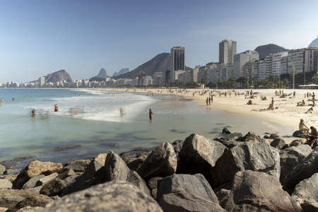 RIO DE JANEIRO, BRAZIL - Long exposure Leme beach on a bright sunny day with blue sky with...
