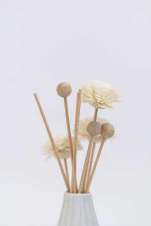 Wooden flowers in a vaseの写真素材