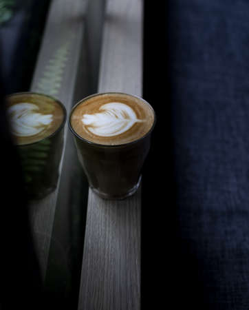 A cup of well-made cappuccino on a windowsillの写真素材