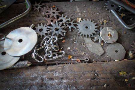 A closeup shot of different types of gears on the ground