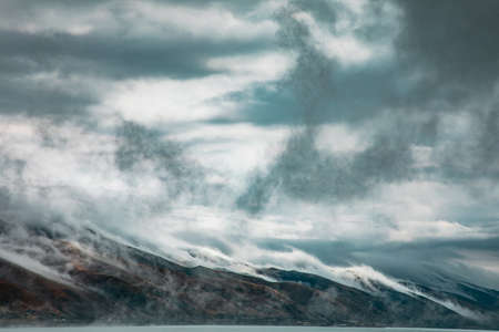 Beautiful shot of clouds and foggy mountainsの写真素材