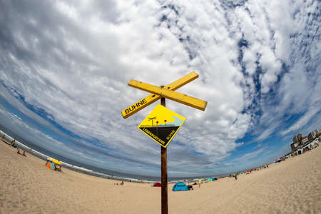 Sign at the beach in Amrum, Germany. Danger of barrieres in the water.の写真素材