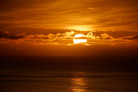 A beautiful distant shot of sea during sunsetの写真素材