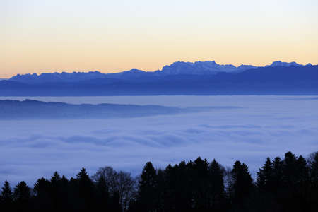 An aerial shot of a beautiful mountain range during a sunset