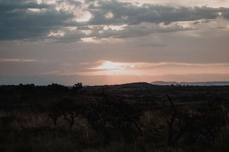 Sunset sky in a large valley with clouds