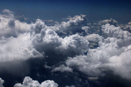 A beautiful view of deep blue sky and cloudscape from airplane window