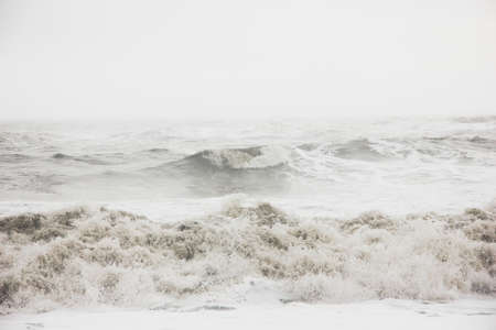 The beautiful scenery of amazing strong ocean waves during misty weather in the countryside