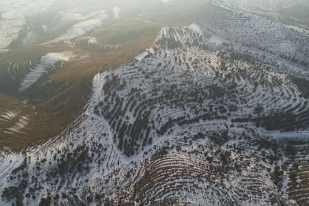 Beautiful snowy hills shot with a drone