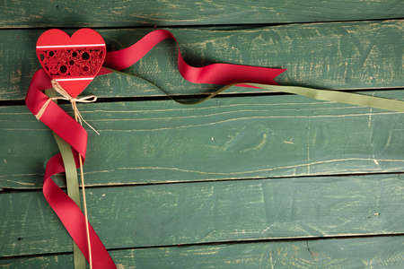 Heart with red and green ribbons wallpaper - Valentine's Dayの写真素材