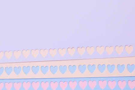 Colorful background with cutout hearts with space for text - Valentine's Day