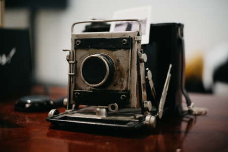 An old vintage camera on a tableの写真素材