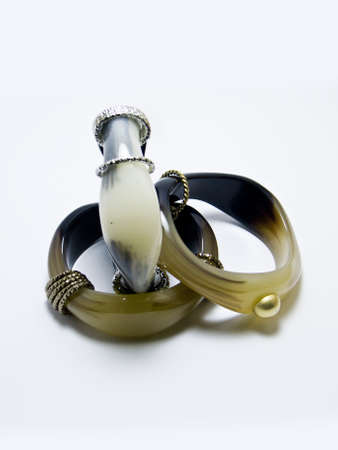 A closeup shot of jewelry on a white background