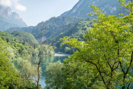 A beautiful view of the calm lake of Tenno and the nature surrounding it, located in Trentino, Italy...