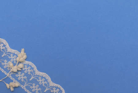 Blue background with white cloth with space for textの写真素材