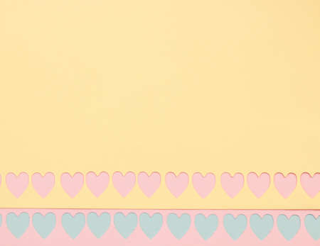 Colorful background with cutout hearts with space for text - Valentine's Day