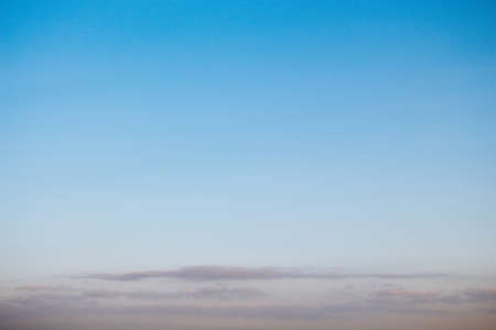 A beautiful blue sky with fluffy clouds at daytime